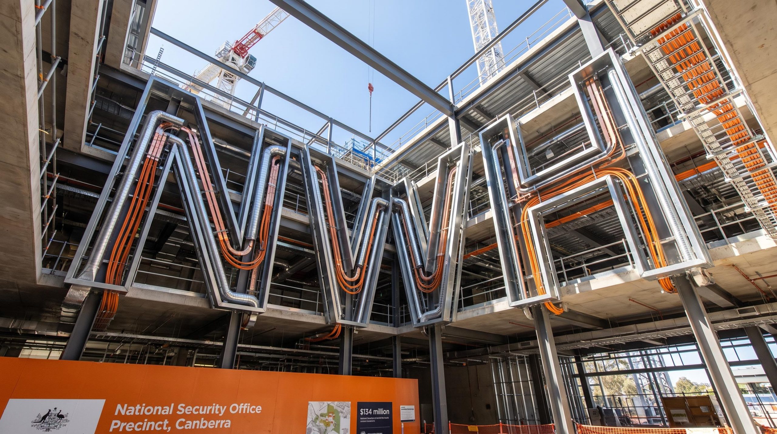 Building under construction with letters