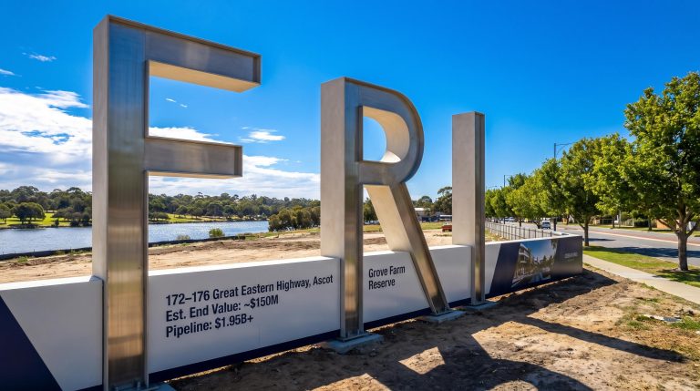 Large metallic letters by river