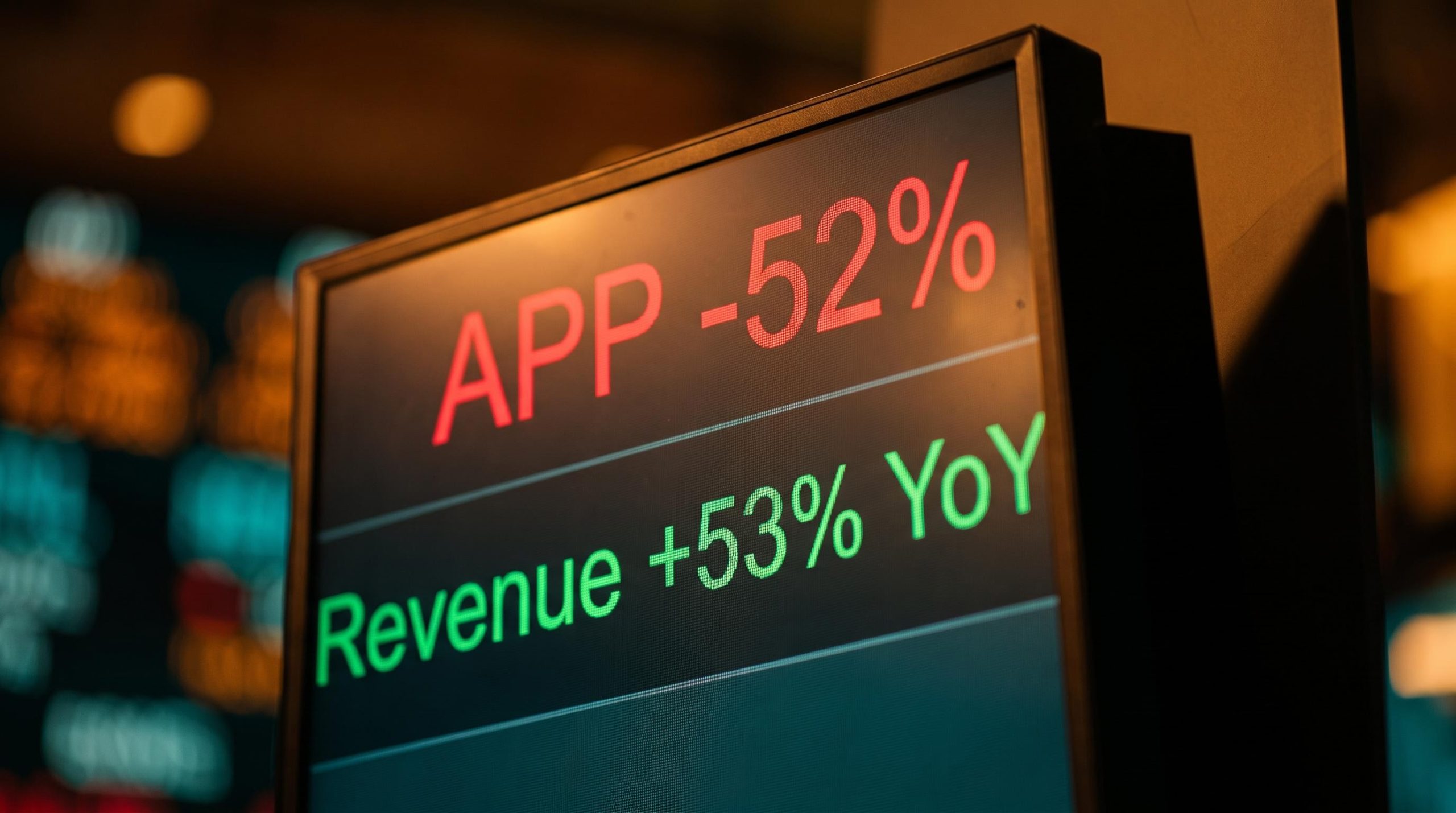 AppLovin valuation contradiction: stock down 52% while revenue grows 53%, shown on a trading screen