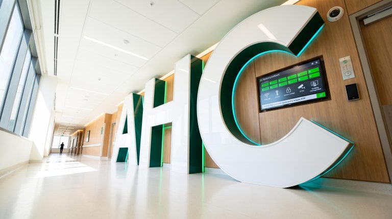 Modern hospital hallway with sign