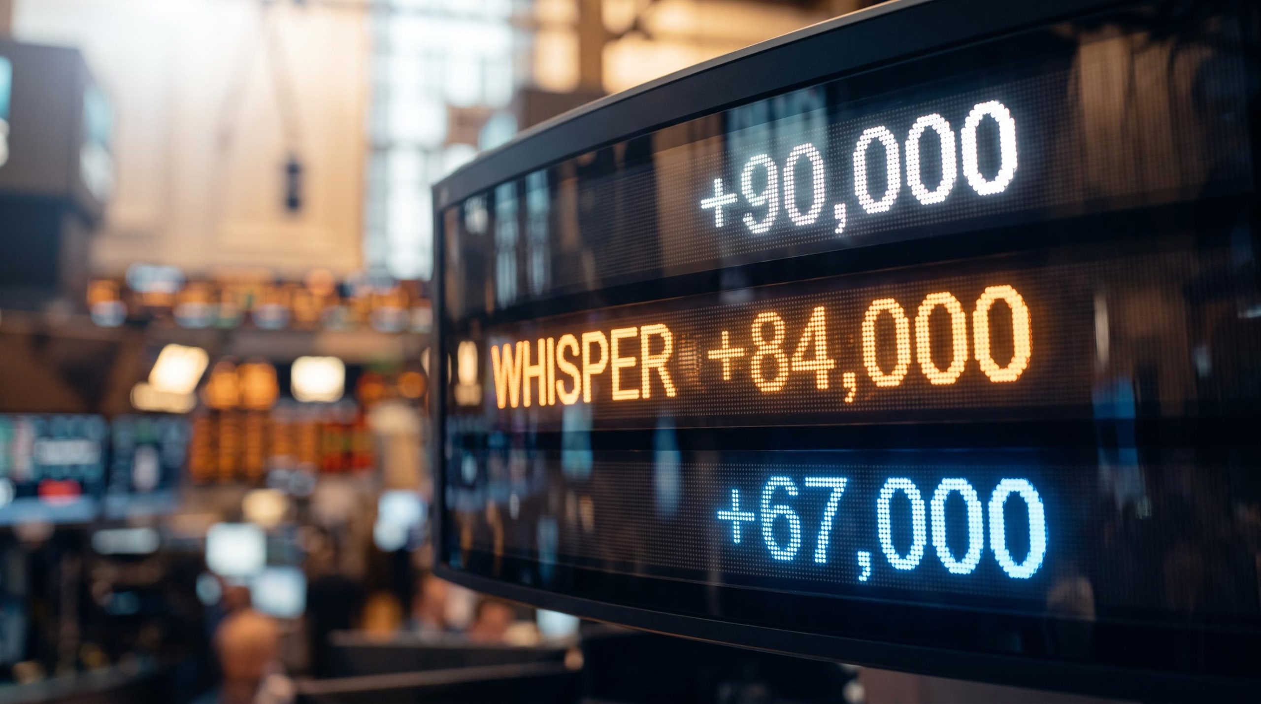 Trading terminal showing NFP consensus, whisper, and leading indicator figures stacked — how to read NFP forecasts