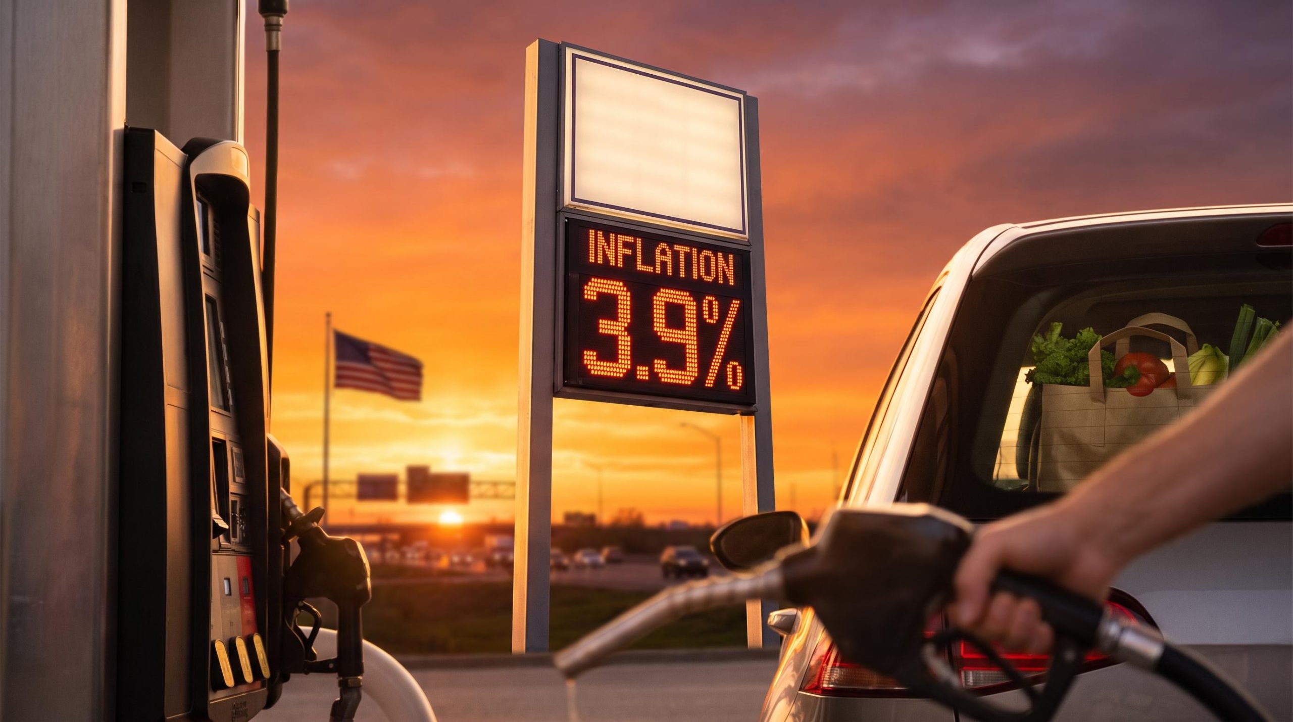 Gas station price sign glowing 3.9% at sunset, symbolising rising NY Fed inflation expectations among US households