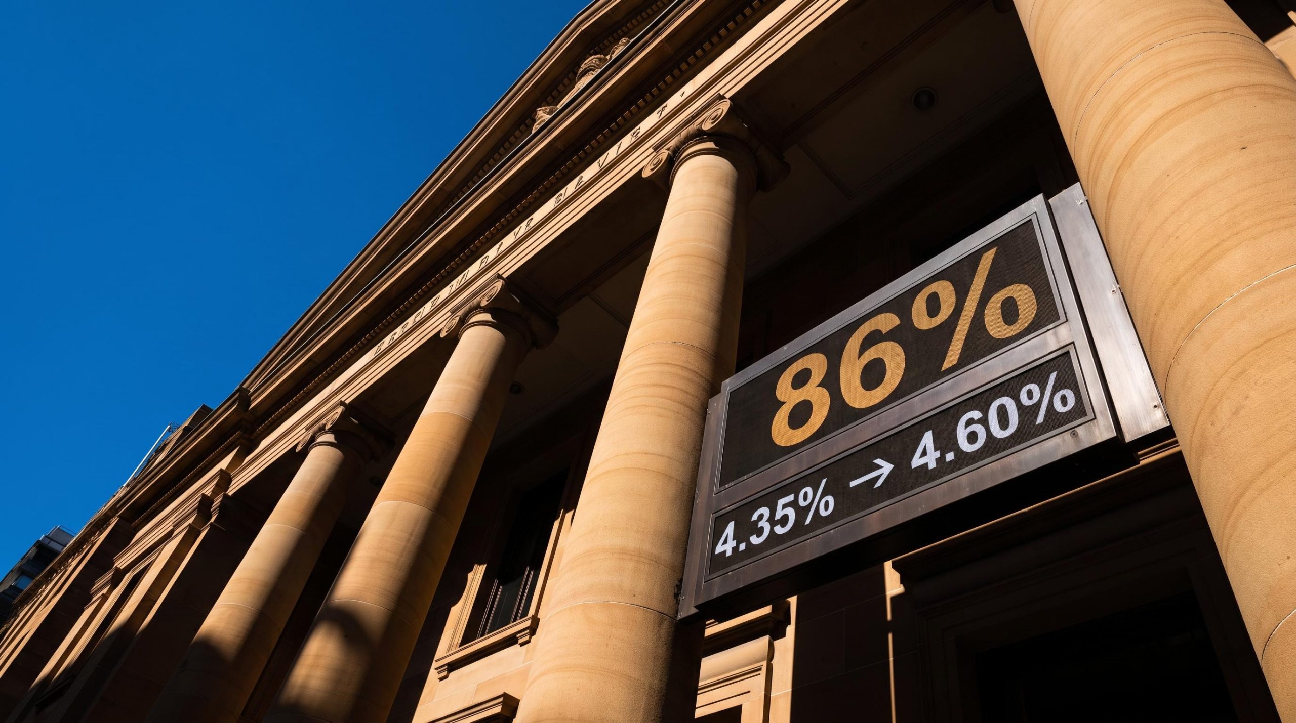 RBA Martin Place facade with 86% hike probability and 4.35%→4.60% rate path displayed ahead of 29 September decision