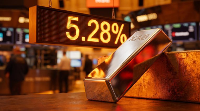 Silver bar tilted downward under a glowing 5.28% Treasury yield display — why silver is falling today