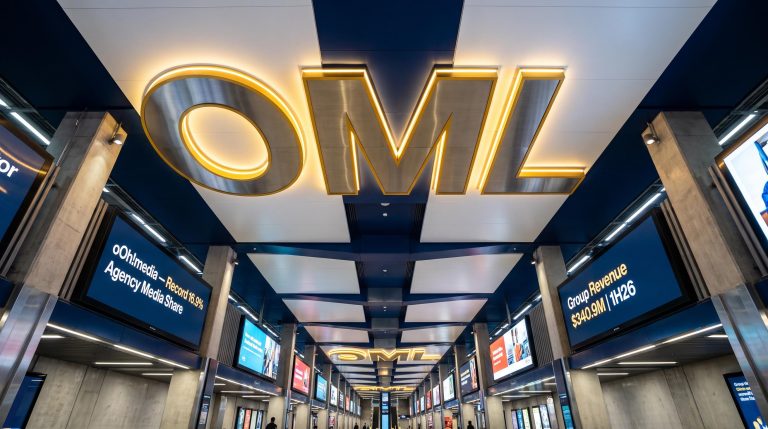 OML ceiling sign in station