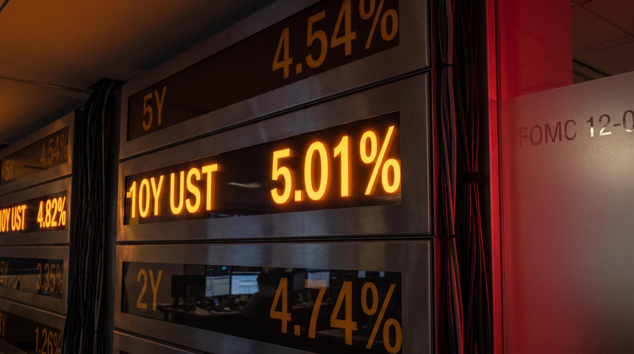 US 10-year Treasury yield at 5.01% on bond trading board as Fed hikes rates 12-0 to 3.75-4.00%