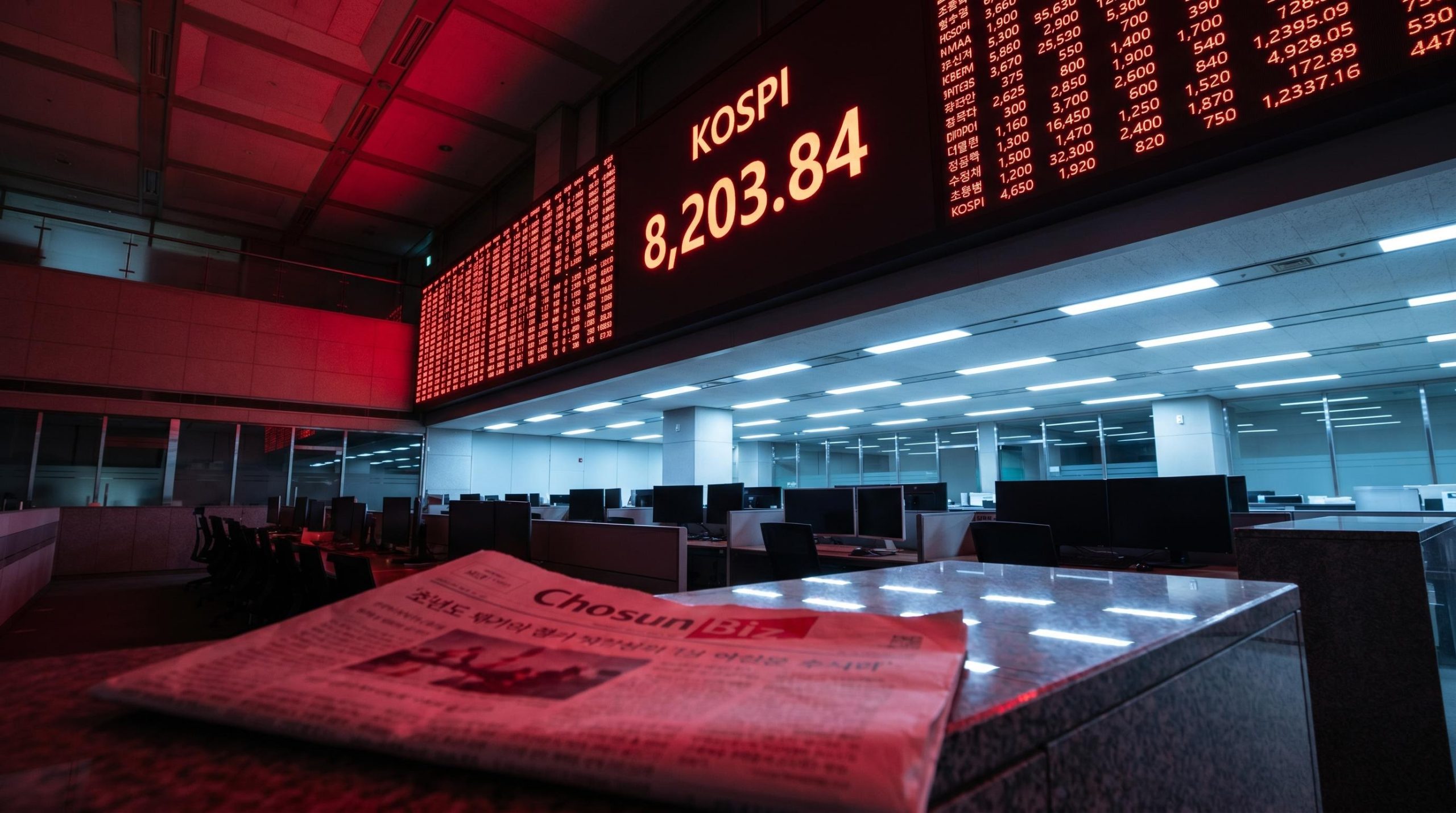 KOSPI trading board showing 8,203.84 after a 9.99% single-day crash triggered by SK Hynix HBM4 report