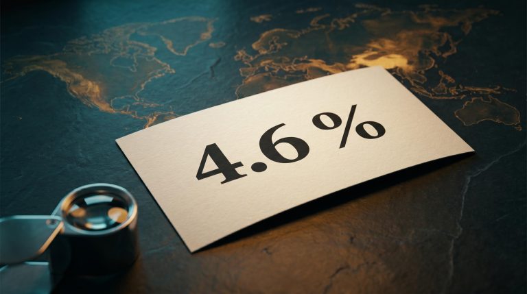 QBE dividend yield of 4.6% on a physical cheque under a jeweller's loupe, with global map etched in slate