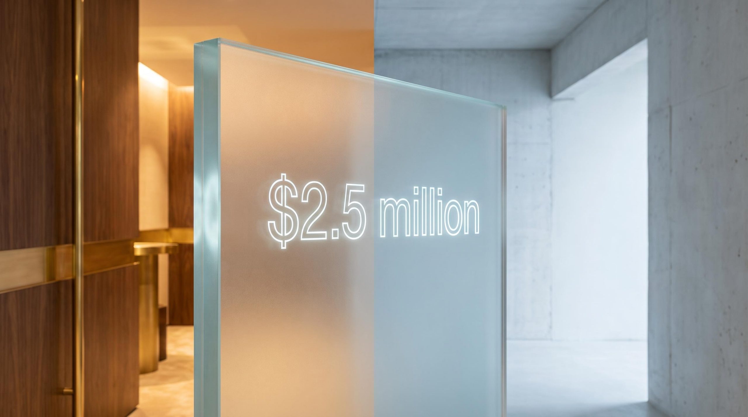 Frosted glass partition etched with "$2.5 million" divides a warm private banking interior from cold open space
